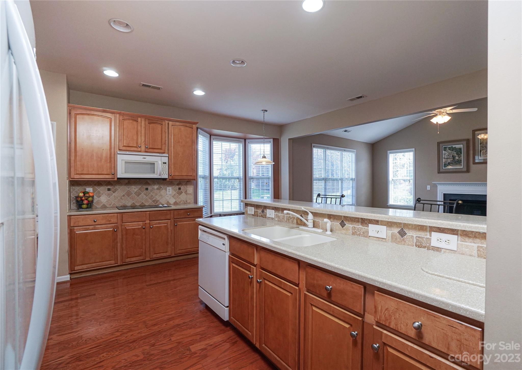 662 Amethyst Circle Fort Mill, SC 29708 - Photo 13 of 34 a large kitchen with kitchen island granite countertop a large window and stainless steel appliances