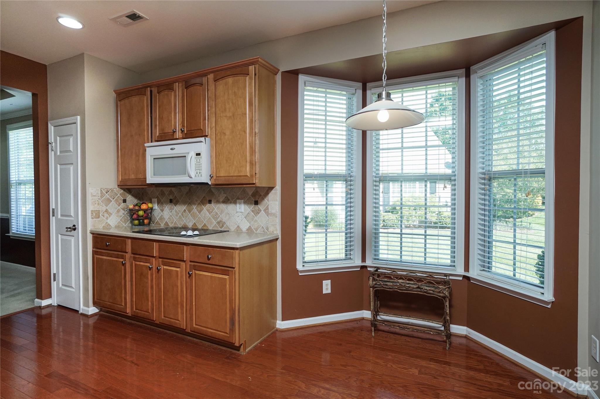 662 Amethyst Circle Fort Mill, SC 29708 - Photo 15 of 34 a kitchen with stainless steel appliances granite countertop a stove a sink and a wooden floors