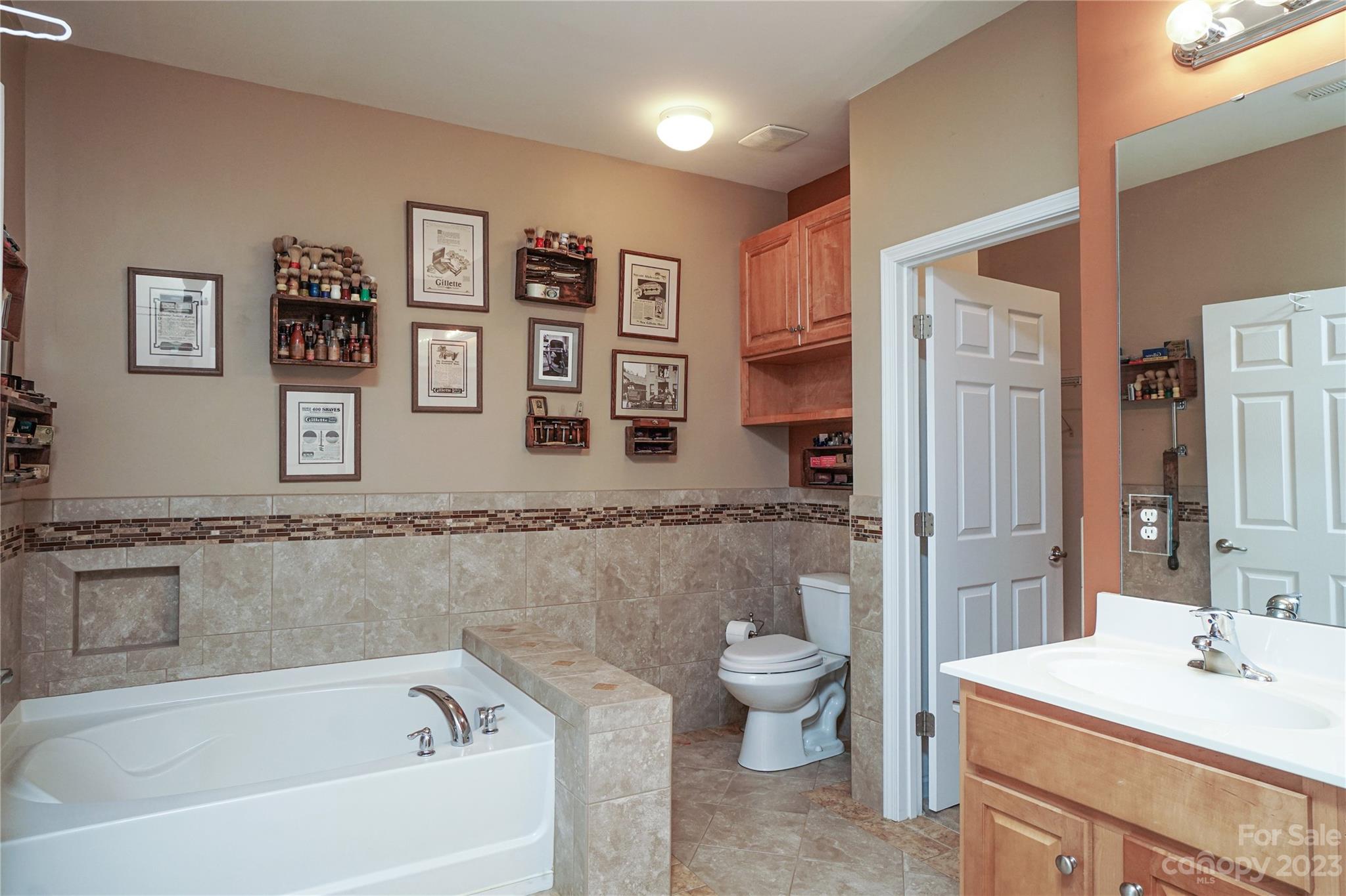 662 Amethyst Circle Fort Mill, SC 29708 - Photo 27 of 34 a bathroom with a bathtub sink mirror vanity and toilet