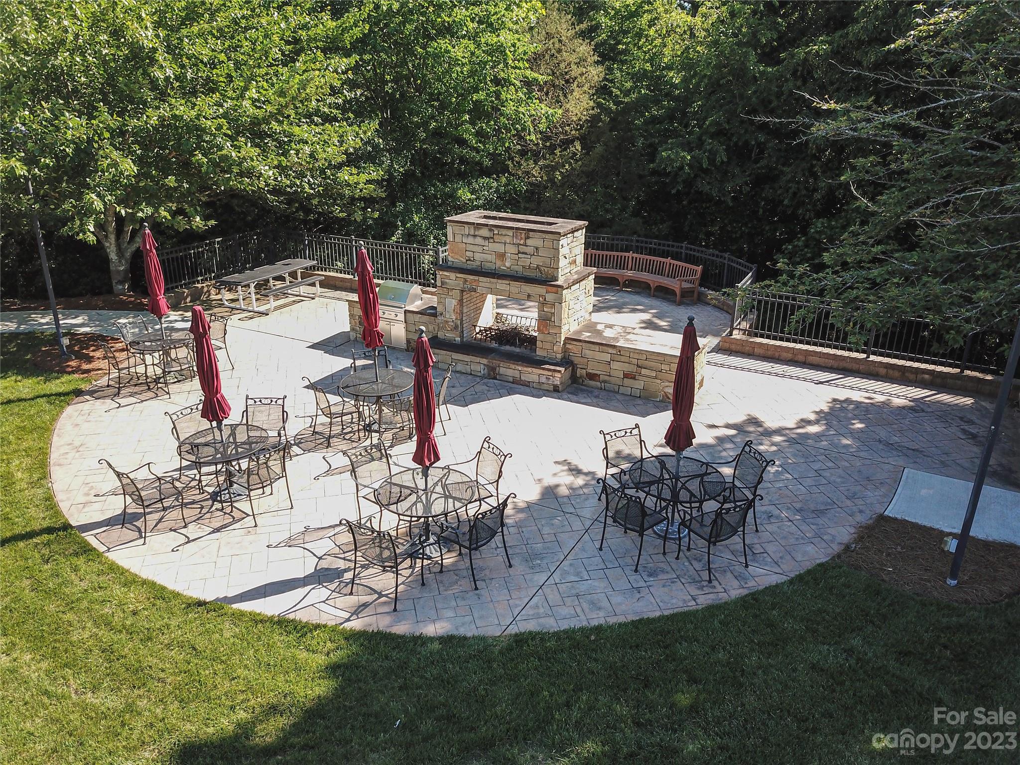662 Amethyst Circle Fort Mill, SC 29708 - Photo 32 of 34 a view of a patio with table and chairs potted plants with large tree