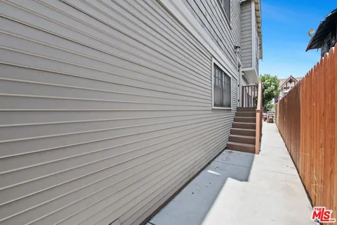 a bathroom with a sink vanity granite and shower