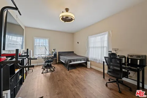 a kitchen with granite countertop a refrigerator stove top oven and sink