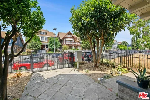 a view of swimming pool with wooden fence