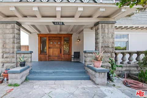 a front view of a house with outdoor seating
