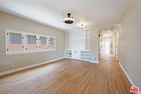 a kitchen with stainless steel appliances granite countertop a refrigerator sink and cabinets