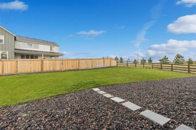 a view of a patio with a garden