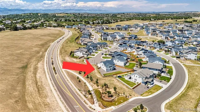 an aerial view of a house with a ocean view