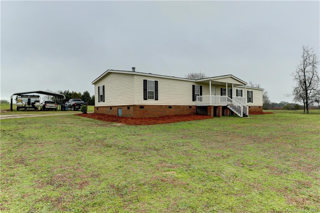 687 Fayette Road York, SC 29745 - Photo 2 of 48 a house view with a garden space