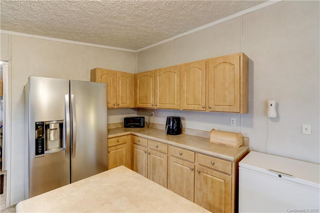 687 Fayette Road York, SC 29745 - Photo 14 of 48 a kitchen with stainless steel appliances a refrigerator sink and cabinets