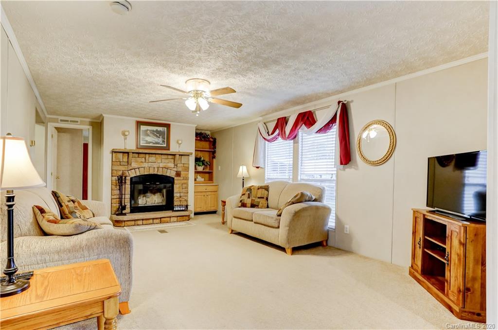 687 Fayette Road York, SC 29745 - Photo 19 of 48 a living room with furniture a flat screen tv and a fireplace