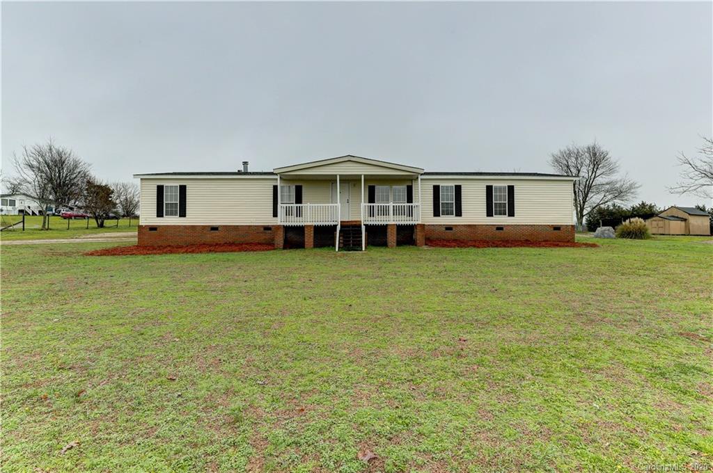 687 Fayette Road York, SC 29745 - Photo 3 of 48 a front view of a house with garden