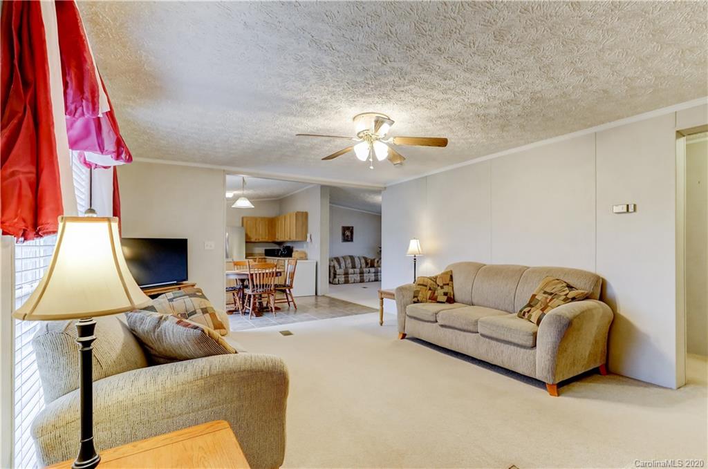 687 Fayette Road York, SC 29745 - Photo 22 of 48 a living room with furniture and a lamp