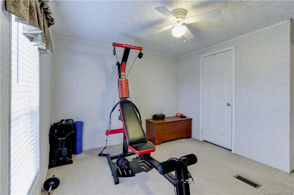 687 Fayette Road York, SC 29745 - Photo 27 of 48 a view of a workspace with furniture and gym equipment
