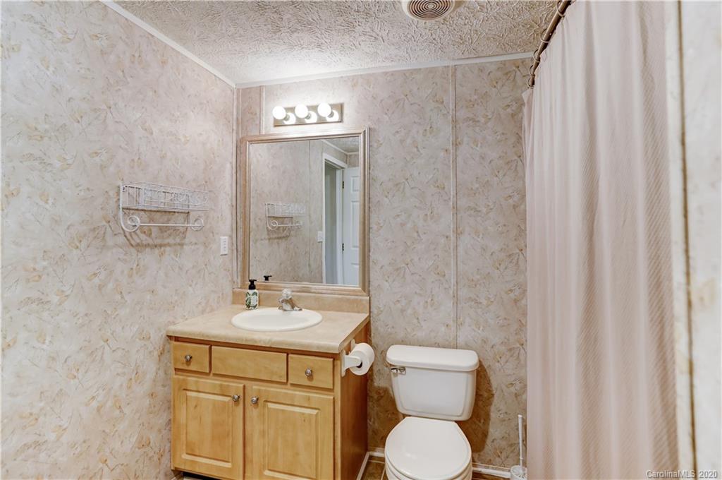 687 Fayette Road York, SC 29745 - Photo 29 of 48 a bathroom with a toilet sink and mirror