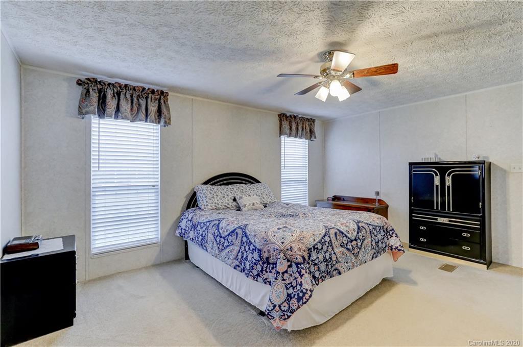 687 Fayette Road York, SC 29745 - Photo 34 of 48 a bedroom with a bed and a ceiling fan