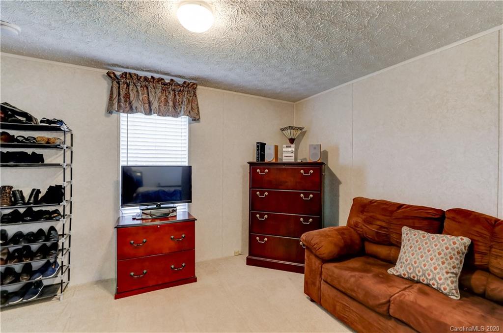 687 Fayette Road York, SC 29745 - Photo 37 of 48 a living room with furniture and a flat screen tv