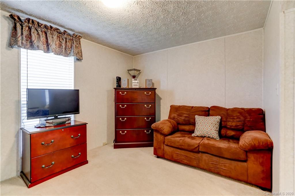 687 Fayette Road York, SC 29745 - Photo 39 of 48 a living room with furniture and a flat screen tv
