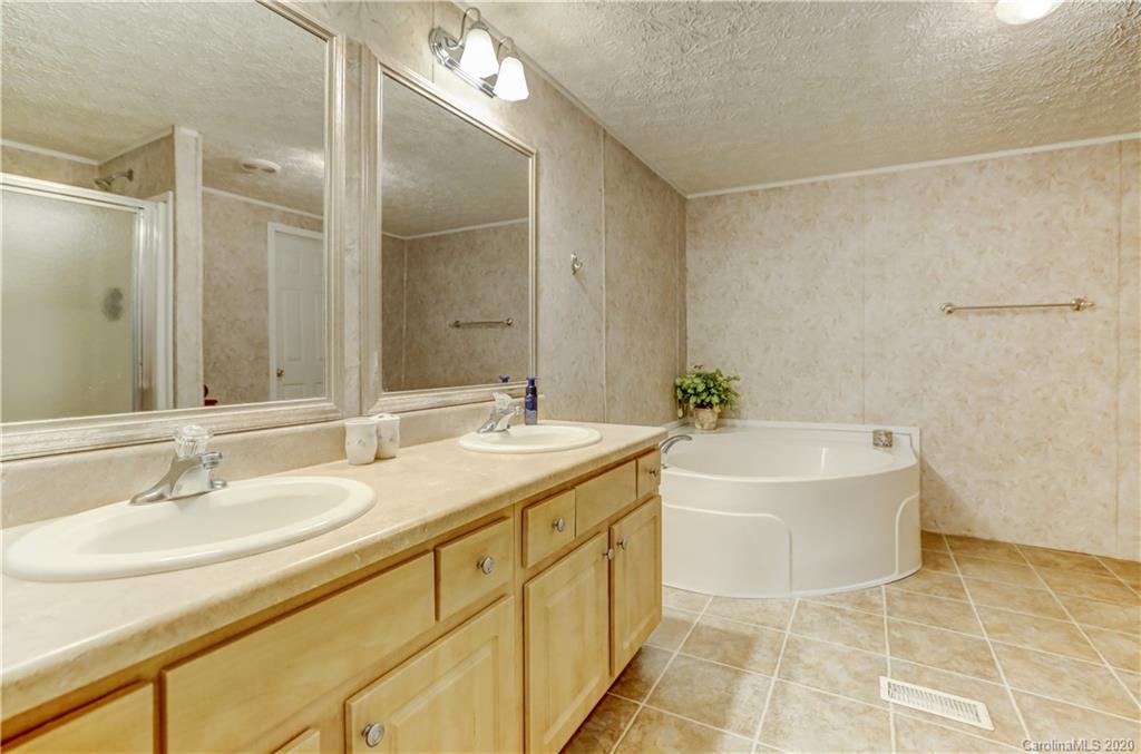 687 Fayette Road York, SC 29745 - Photo 40 of 48 a bathroom with a tub sink and mirror