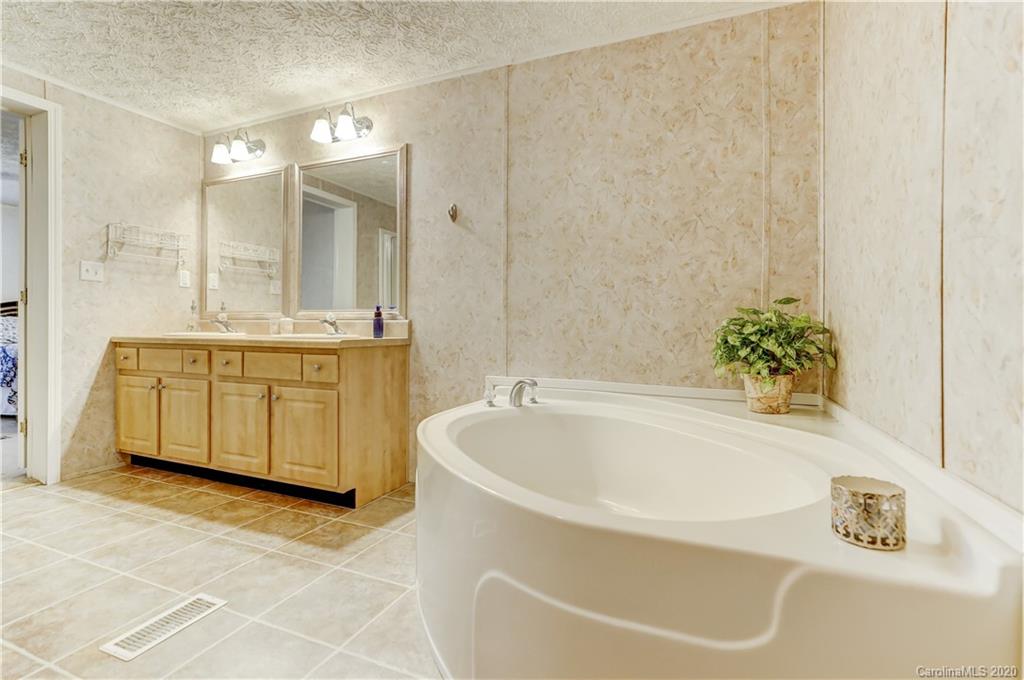 687 Fayette Road York, SC 29745 - Photo 41 of 48 a white bath tub sitting next to a white sink