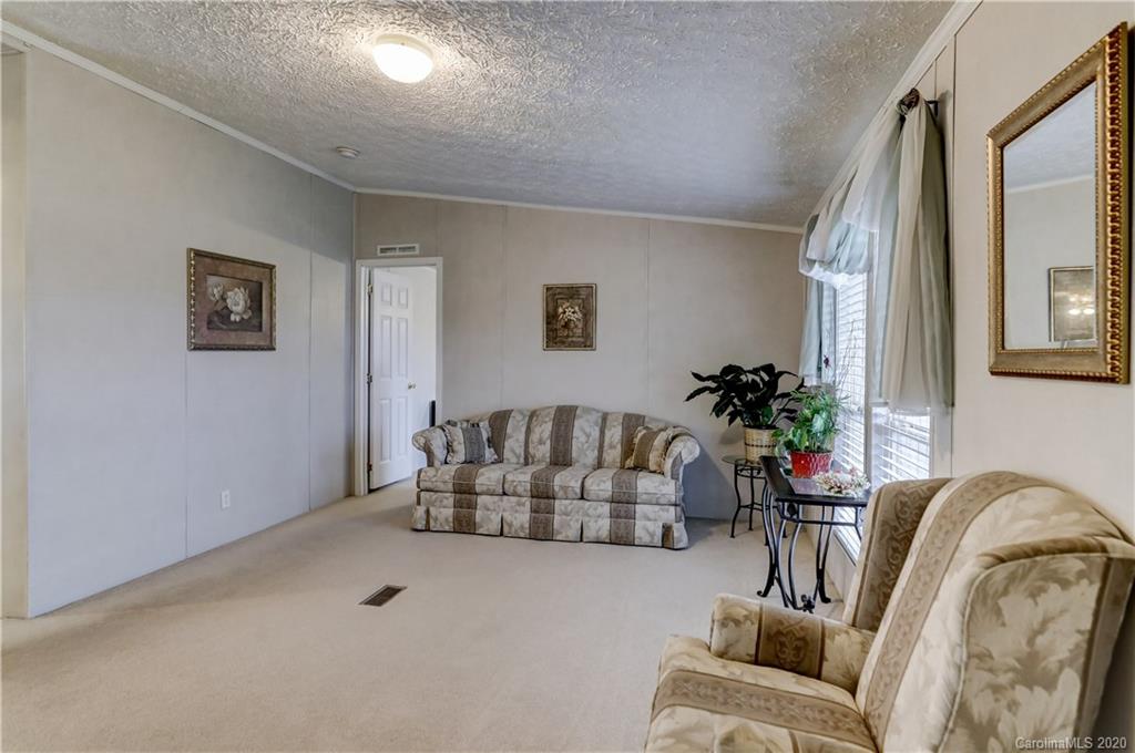 687 Fayette Road York, SC 29745 - Photo 6 of 48 a living room with furniture flowerpot and a potted plant