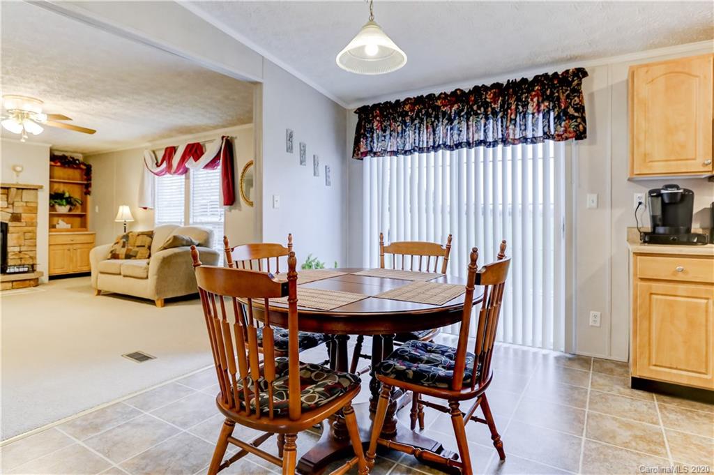687 Fayette Road York, SC 29745 - Photo 10 of 48 a view of a dining room with furniture window and wooden floor