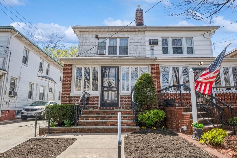944 81st Street Brooklyn, NY 11228 - Photo 1 of 1 a front view of a house with garden