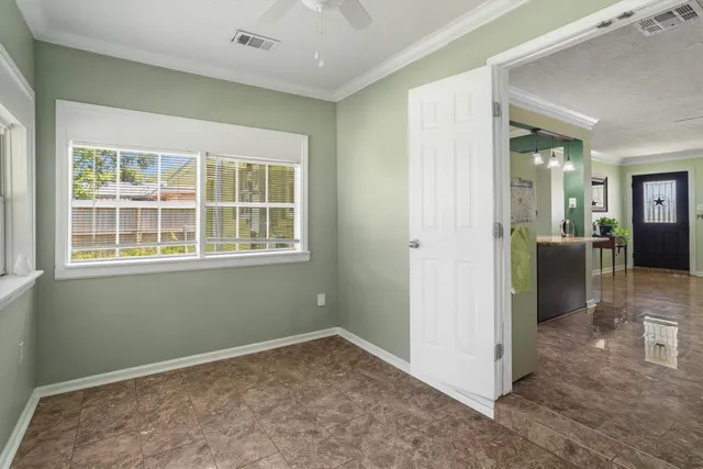 an empty room that has a window in it