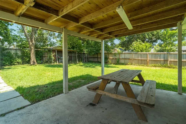 a view of a swimming pool with a patio
