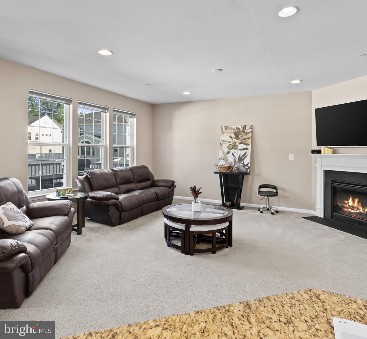 1307 North Sewards Court Aberdeen, MD 21001 - Photo 18 of 65 a living room with furniture a flat screen tv and a fireplace