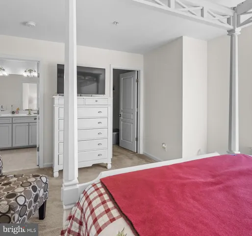 a bathroom with a shower and a mirror