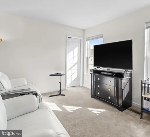 a view of a hallway with windows