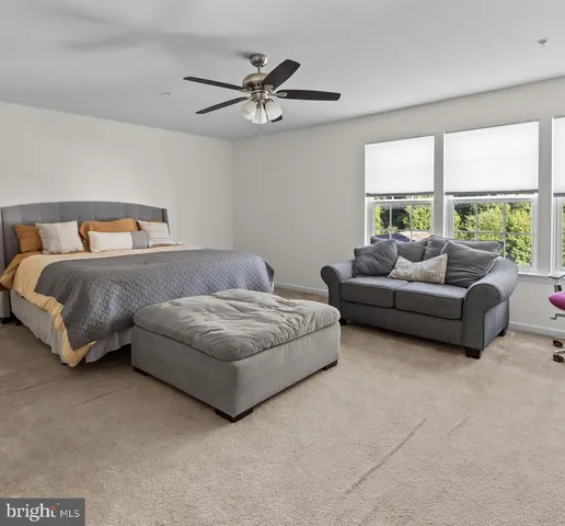 a view of a room with gym equipment and a large window