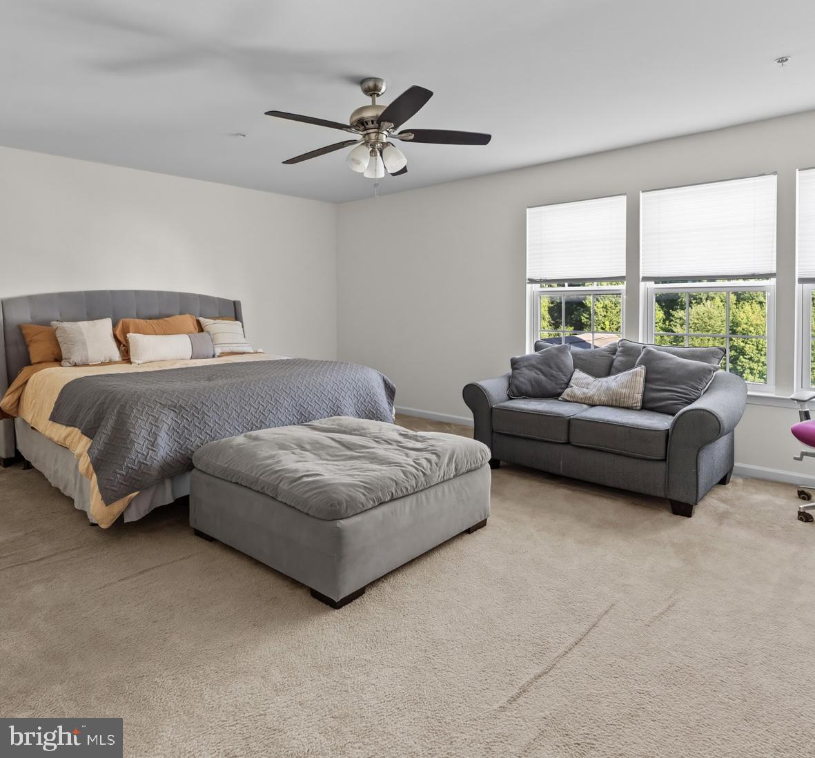1307 North Sewards Court Aberdeen, MD 21001 - Photo 40 of 65 a bedroom with a bed couch and a large window