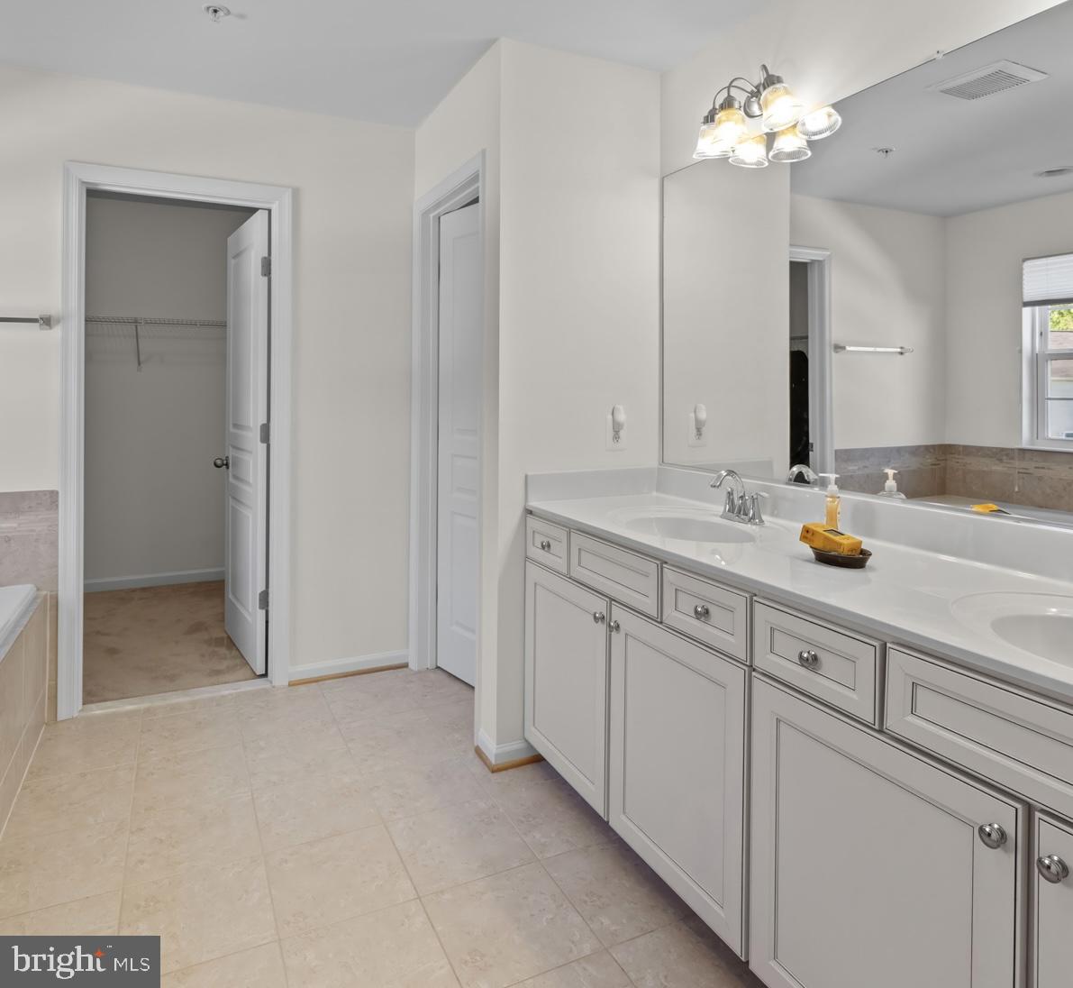1307 North Sewards Court Aberdeen, MD 21001 - Photo 42 of 65 a bathroom with a sink double vanity and a mirror