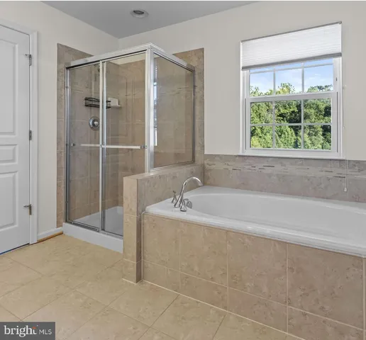 a living room with lots of furniture and gym equipment