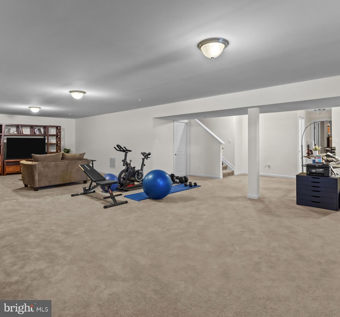 1307 North Sewards Court Aberdeen, MD 21001 - Photo 48 of 65 a view of a room with gym equipment and a large window