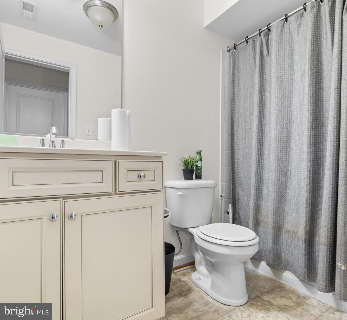 1307 North Sewards Court Aberdeen, MD 21001 - Photo 54 of 65 a white toilet sitting next to a bathroom sink