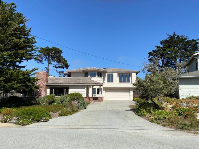 3049 Cormorant Road Pebble Beach, CA 93953 - Photo 1 of 42 a front view of a house with a garden