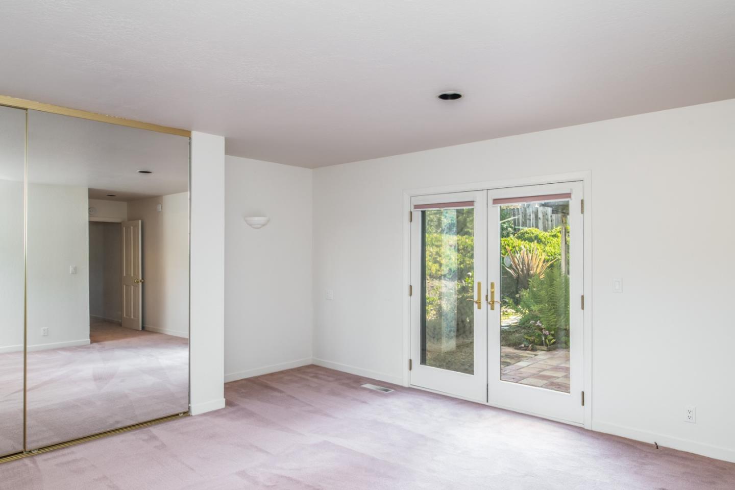 3049 Cormorant Road Pebble Beach, CA 93953 - Photo 18 of 42 a view of an empty room with glass door