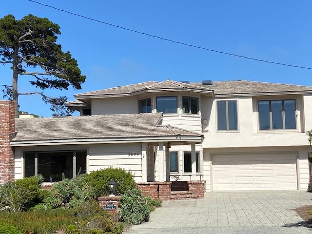 3049 Cormorant Road Pebble Beach, CA 93953 - Photo 2 of 42 a front view of a house with garage