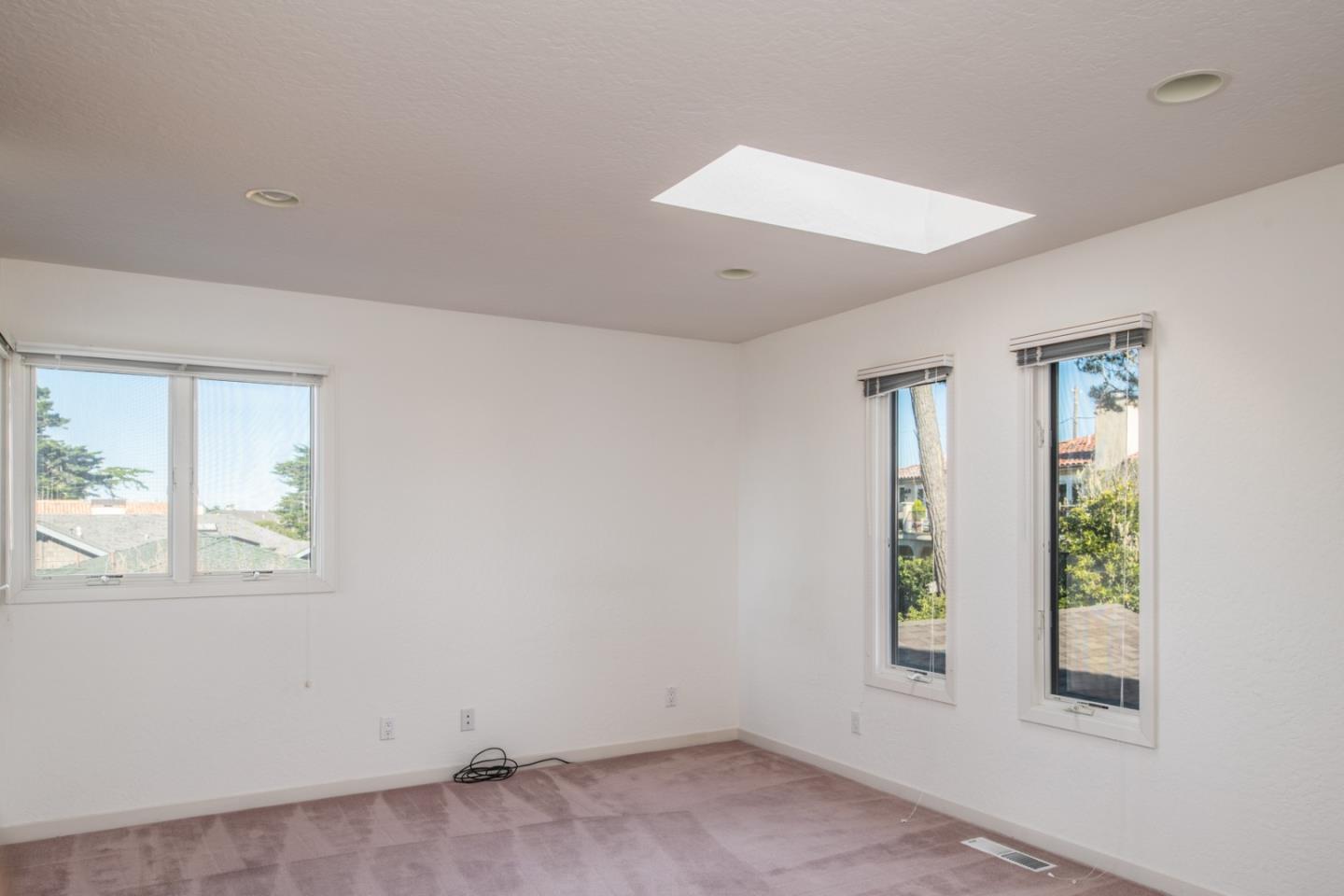 3049 Cormorant Road Pebble Beach, CA 93953 - Photo 38 of 42 an empty room with windows