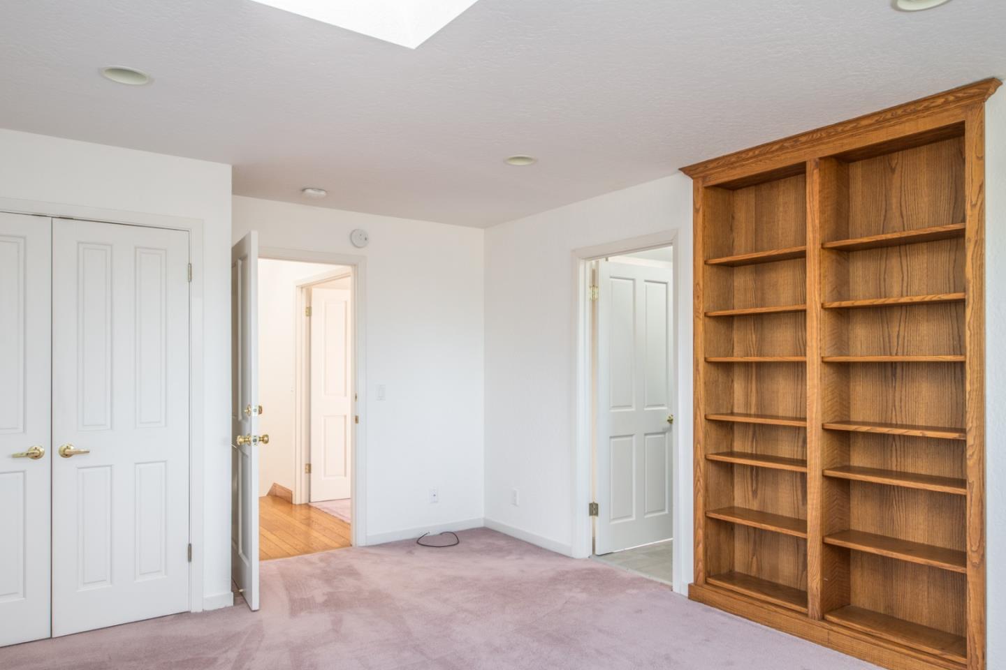 3049 Cormorant Road Pebble Beach, CA 93953 - Photo 39 of 42 a view of an empty room with empty shelves