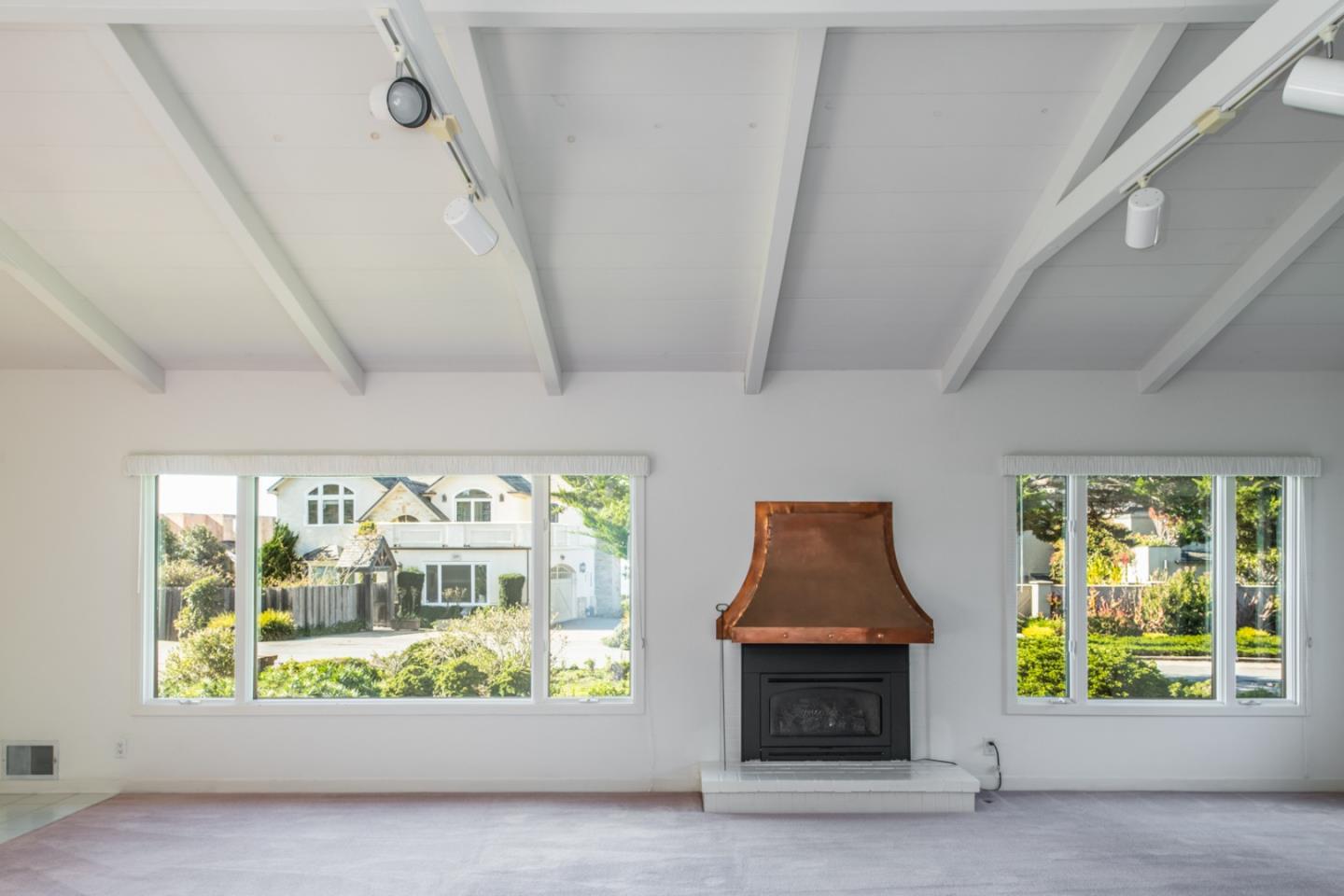 3049 Cormorant Road Pebble Beach, CA 93953 - Photo 6 of 42 a room with furniture and a fireplace