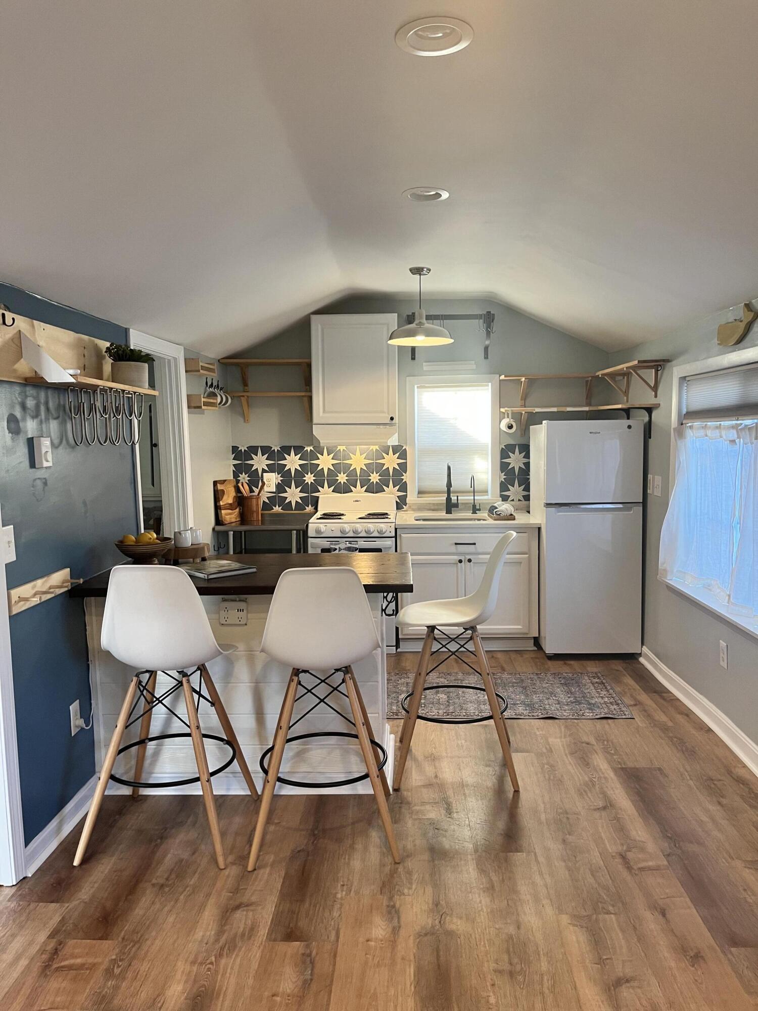 8 Trinity Lane Wareham, MA 02571 - Photo 14 of 49 a kitchen with a dining table chairs and refrigerator