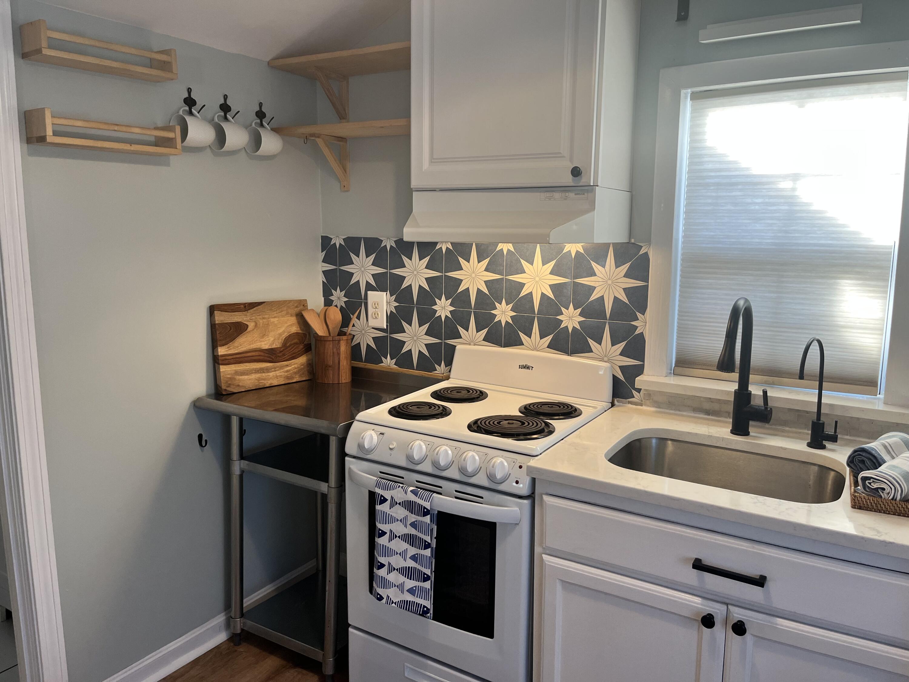 8 Trinity Lane Wareham, MA 02571 - Photo 17 of 49 a kitchen with a sink stove and cabinets