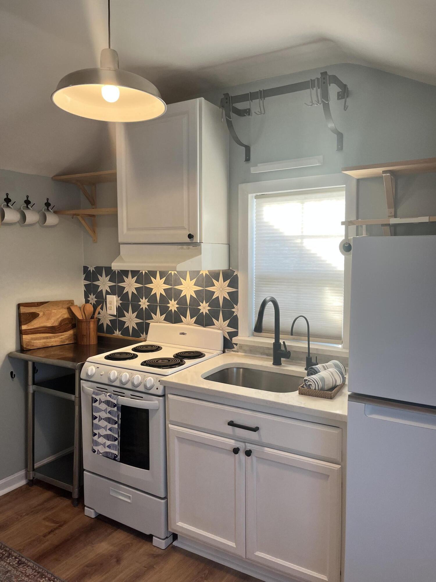 8 Trinity Lane Wareham, MA 02571 - Photo 18 of 49 a kitchen with a stove cabinets and a refrigerator