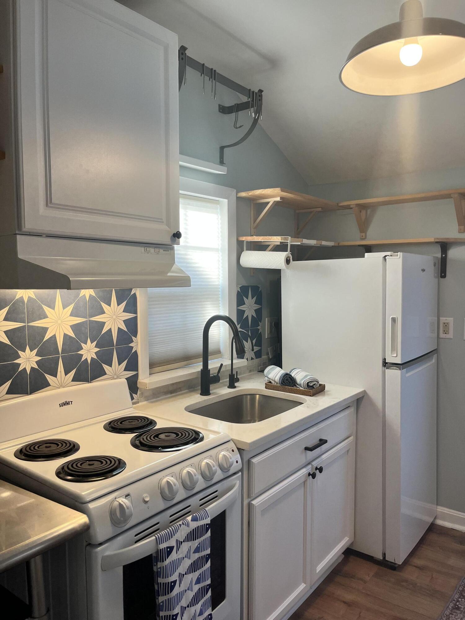 8 Trinity Lane Wareham, MA 02571 - Photo 19 of 49 a kitchen with stainless steel appliances granite countertop a stove and a sink