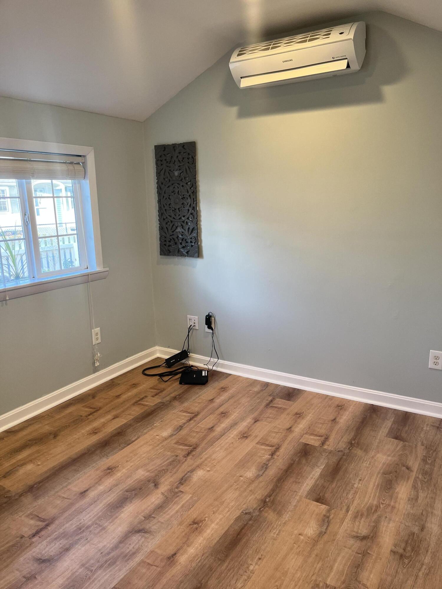 8 Trinity Lane Wareham, MA 02571 - Photo 22 of 49 a view of a room with wooden floor and a window