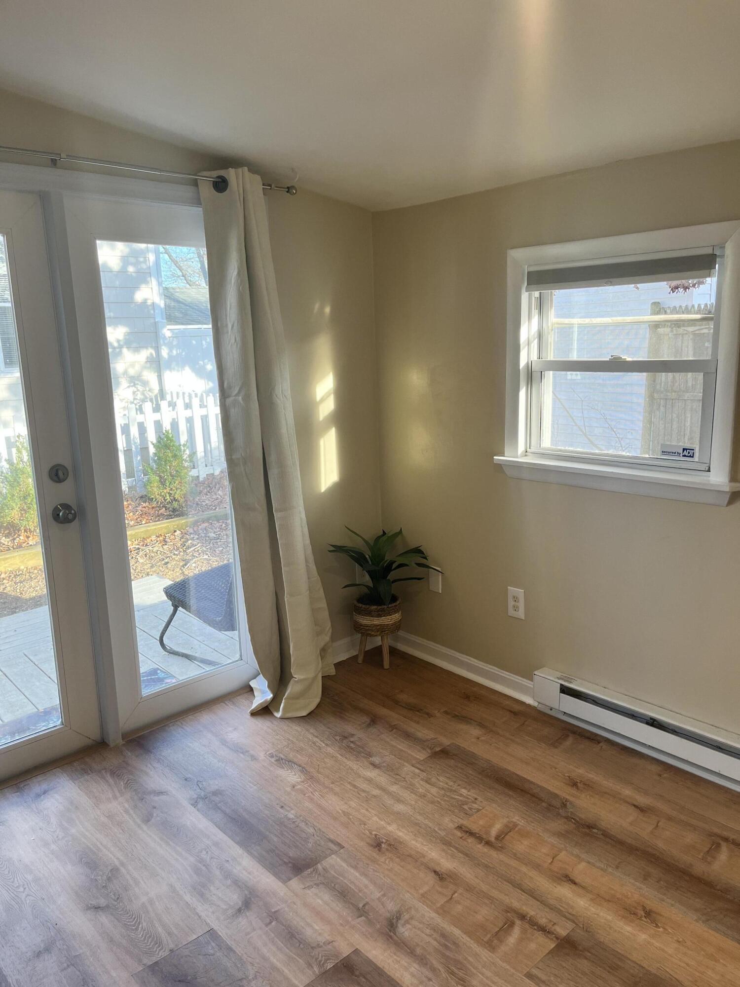 8 Trinity Lane Wareham, MA 02571 - Photo 23 of 49 wooden floor in an empty room with a window