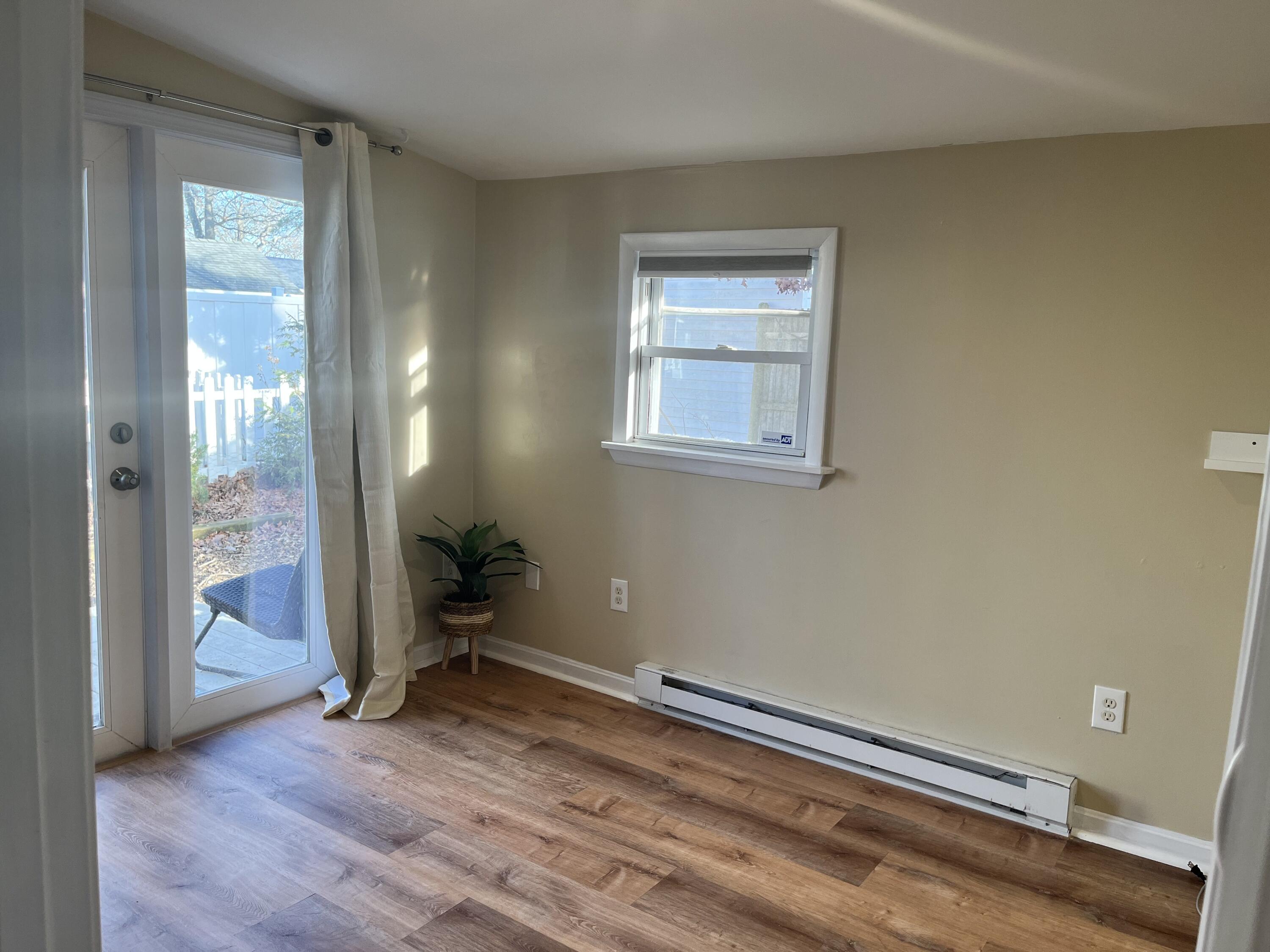 8 Trinity Lane Wareham, MA 02571 - Photo 26 of 49 wooden floor in an empty room with a window